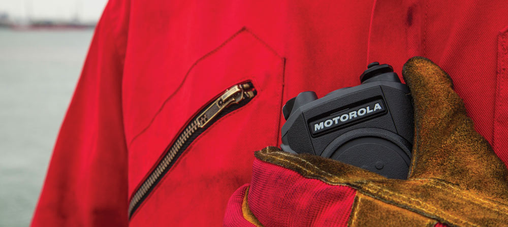 person holding Motorola two way radio